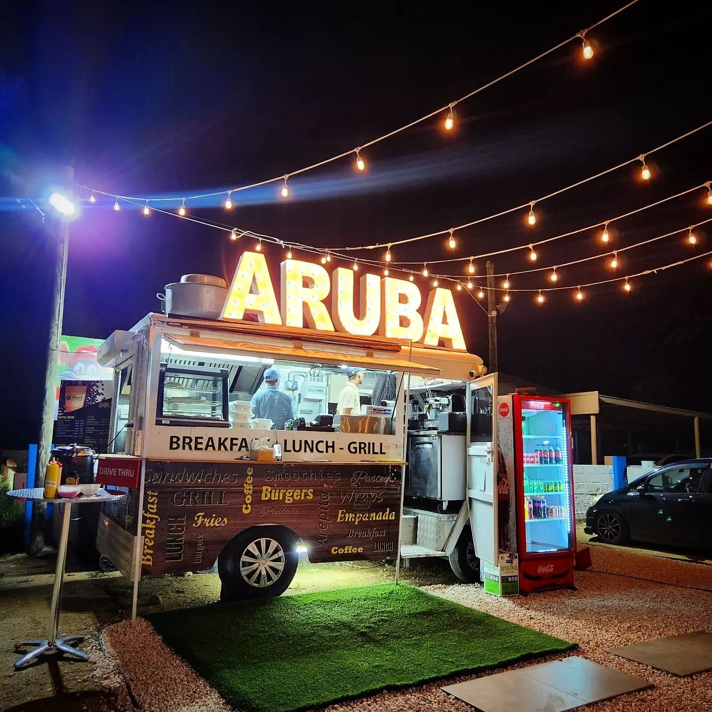 Fully wrapped Aruba food truck at night