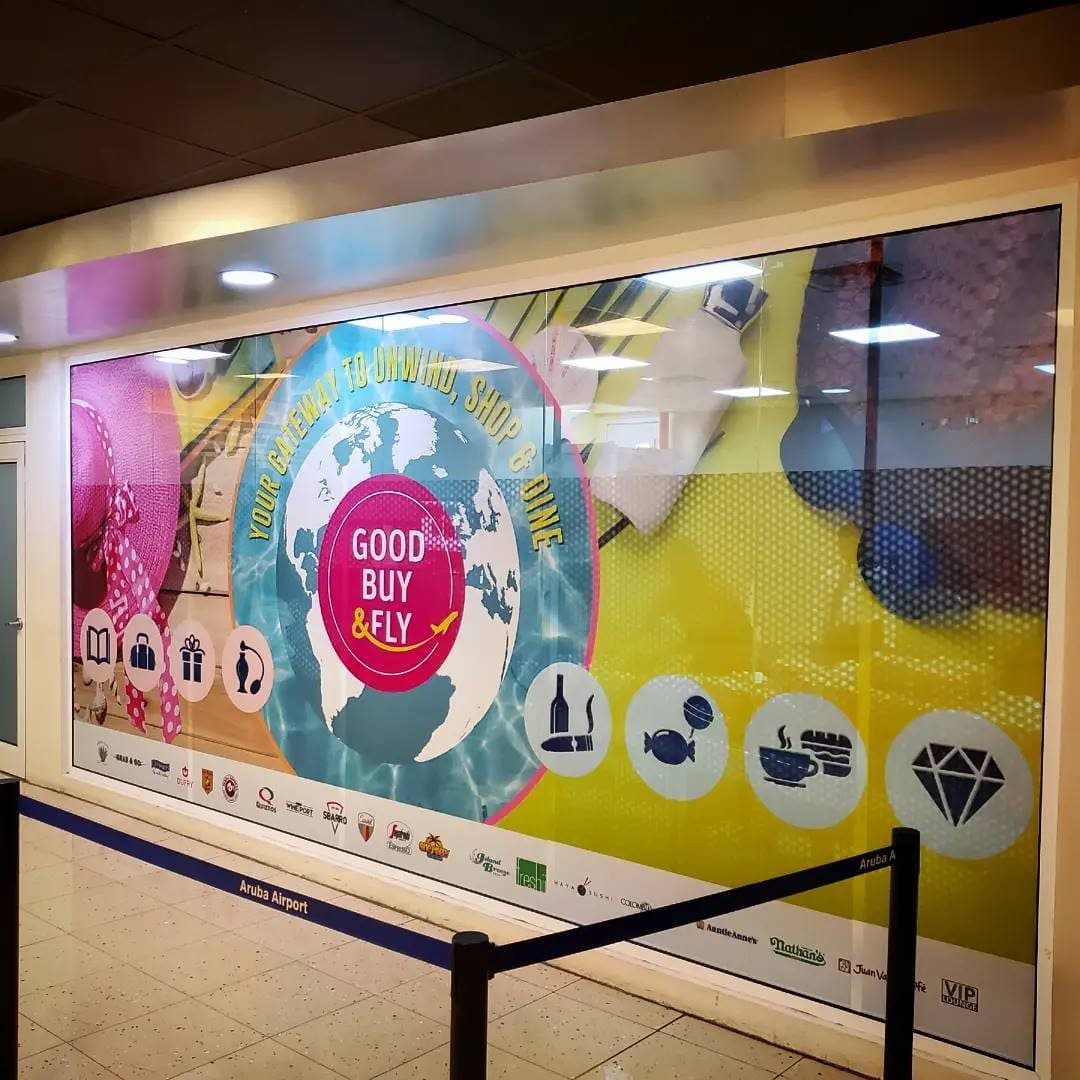 Full-color window graphics for a duty-free store