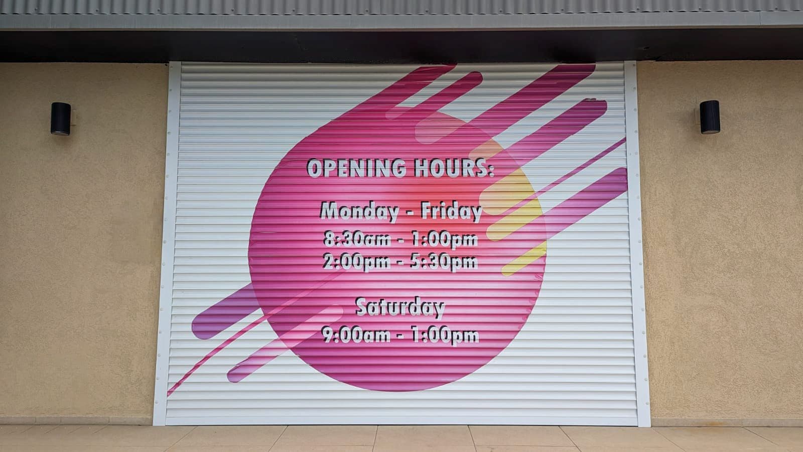 Laminated opening-hours panel on a storefront